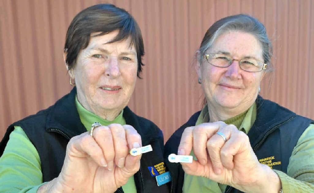 Receiving their 10 and five-year service badges respectively are Visitor Information Centre volunteers Gloria McKechnie and Jenny Loy. Receiving their 10 and five-year service badges respectively are Visitor Information Centre volunteers Gloria McKechnie and Jenny Loy.